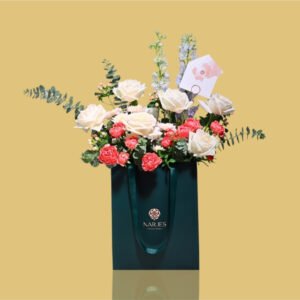 luxury floral display in signature green bag
