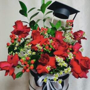 graduation bouquet – yellow & orange roses in black leather cone