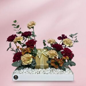 red roses & cream carnation gift arrangement on white acrylic