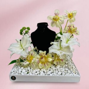 elegant floral necklace display with white lilies & beige tulips on acrylic base