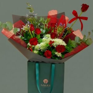 signature green bag bouquet – red roses, blue & white blooms