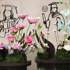 graceful graduation arrangement – blue orchids & white florals