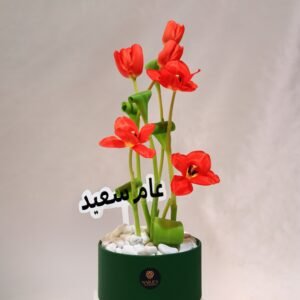 orange tulip arrangement in luxury leather container