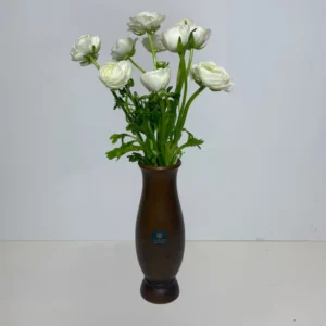 white ranunculus arrangement in oak vase